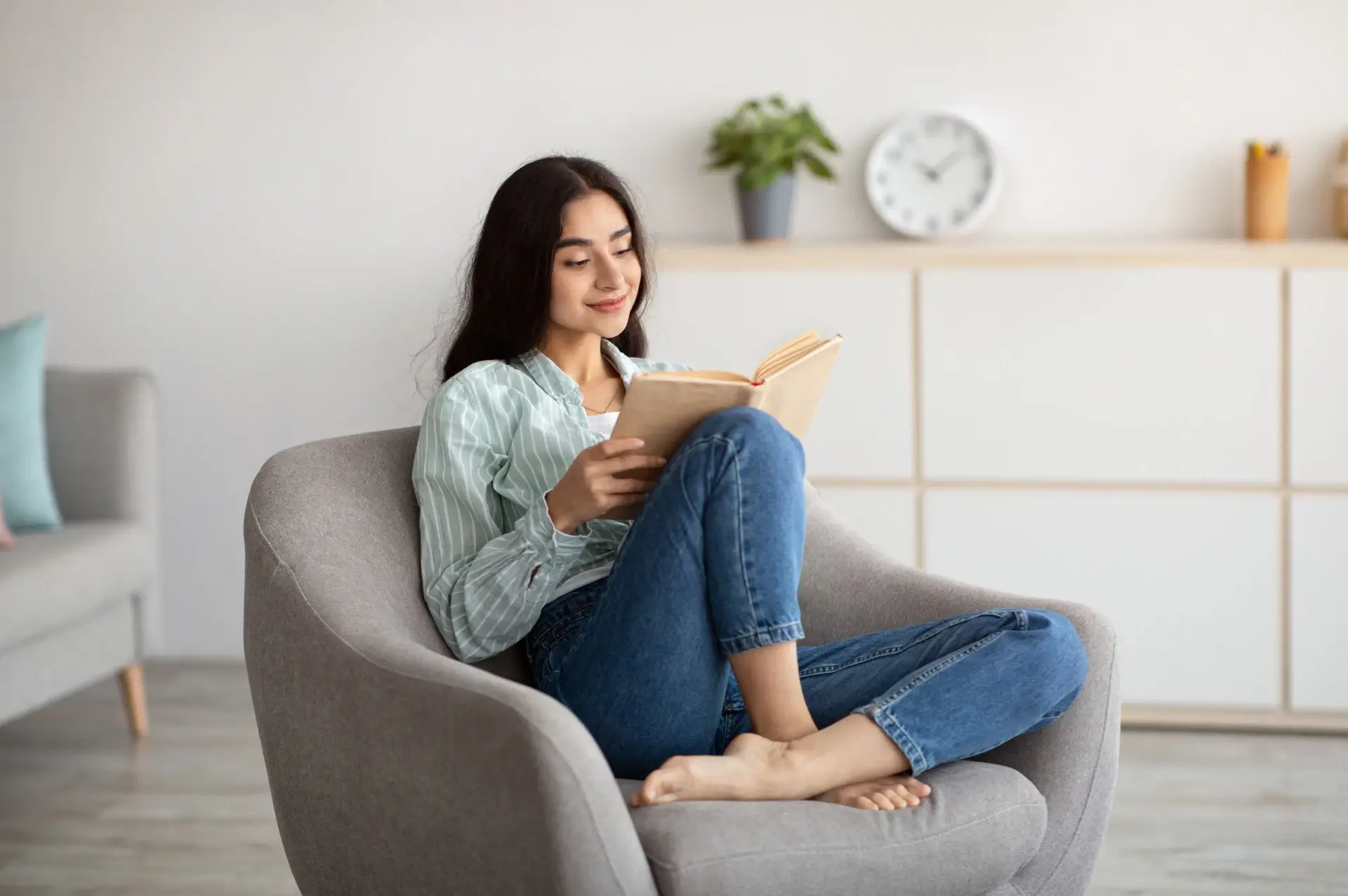 Person comfortably reading in a well-designed chair