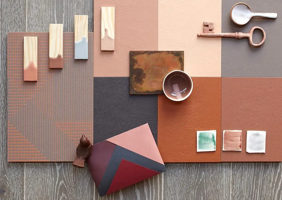 A mood board with fabric swatches, color samples, and wood finishes